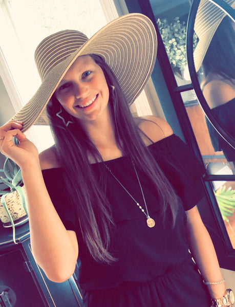 Wide brimmed floppy hat